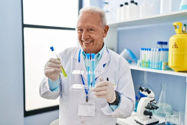 Senior Man Wearing Scientist Uniform Holding Test Tubes Laboratory — Stock Photo, Image