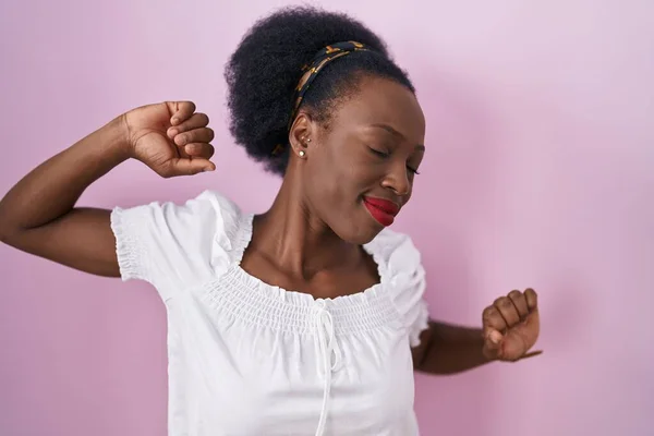 African Woman Curly Hair Standing Pink Background Stretching Back Tired — Stok fotoğraf