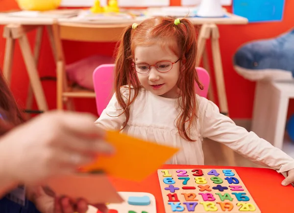 Adorable Redhead Girl Playing Maths Puzzle Game Sitting Table Kindergarten — Foto Stock