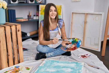 Adorable girl artist smiling confident drawing at art studio