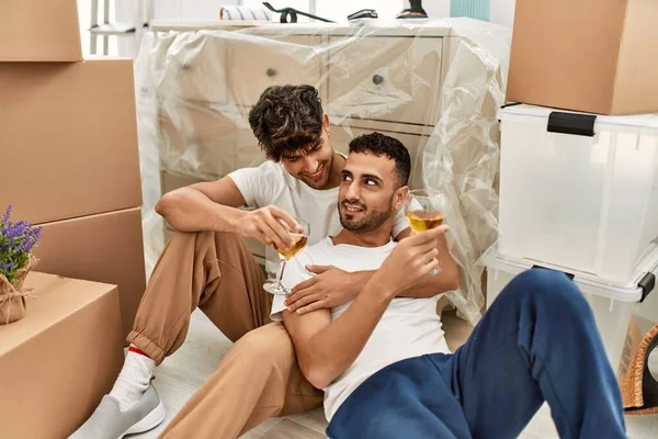 Two Hispanic Men Couple Smiling Confident Drinking Wine New Home — Fotografia de Stock