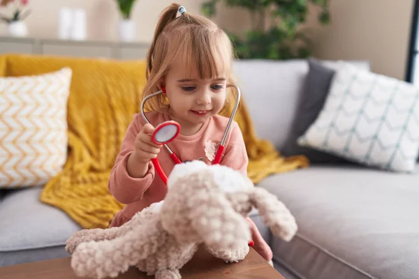 Adorable Blonde Girl Playing Doctor Examining Teddy Bear Stethoscope Home — Stock Photo, Image