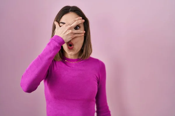 Hispanic Woman Standing Pink Background Peeking Shock Covering Face Eyes — Photo