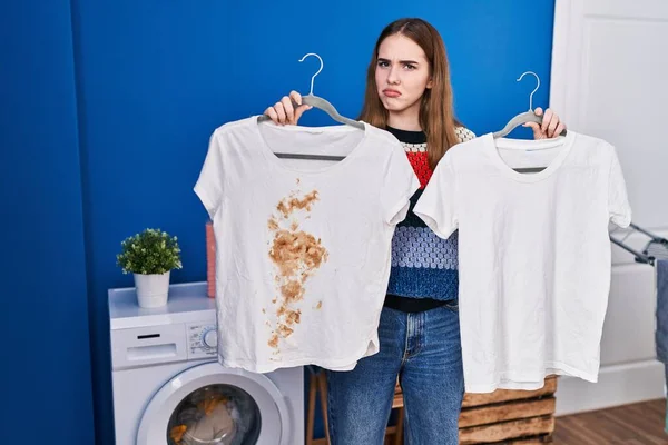 Young Hispanic Girl Holding Clean White Shirt Shirt Dirty Stain — Stockfoto