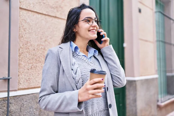 Young Hispanic Woman Executive Drinking Coffee Talking Smartphone Street — Stock fotografie