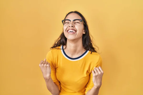 Young Brazilian Woman Wearing Glasses Yellow Background Very Happy Excited — Zdjęcie stockowe