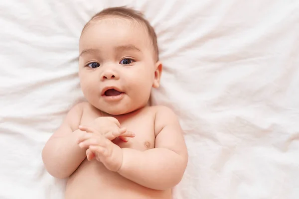 Adorable Hispanic Toddler Smiling Confident Lying Bed Bedroom — Zdjęcie stockowe