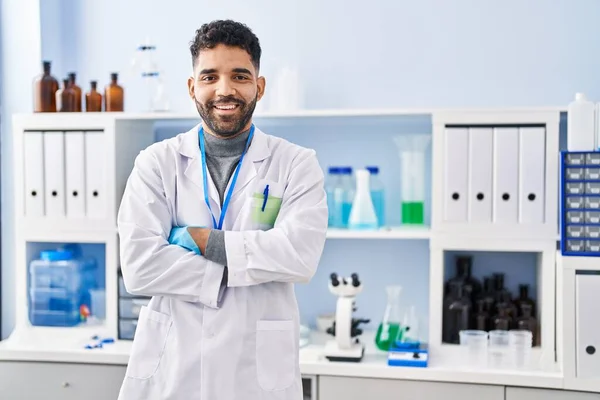 Young Hispanic Man Wearing Scientist Uniform Standing Arms Crossed Gesture — Photo