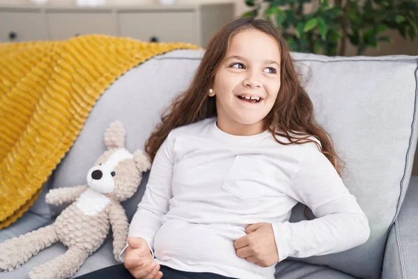 Adorable Hispanic Girl Smiling Confident Sitting Sofa Home — Stok fotoğraf