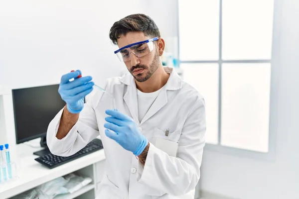 Handsome Hispanic Man Working Scientific Holding Test Tube Laboratory —  Fotos de Stock