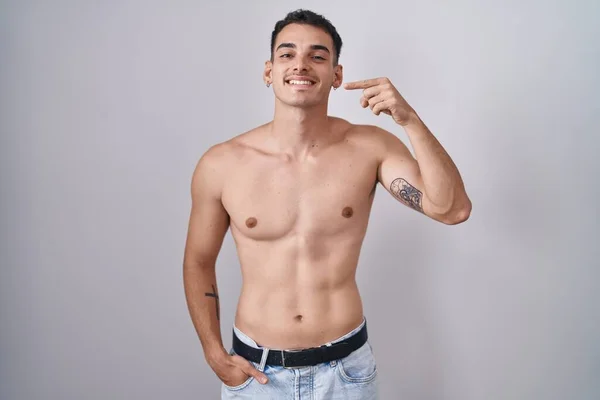 Handsome Hispanic Man Standing Shirtless Smiling Cheerful Showing Pointing Fingers — Stockfoto
