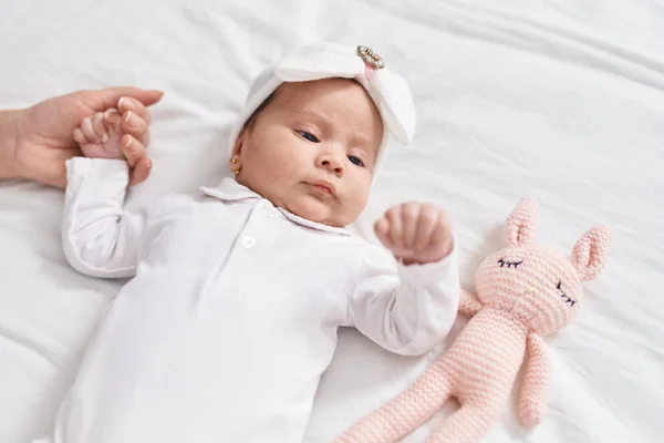 Adorable Hispanic Baby Lying Bed Holding Mother Hand Bedroom — Stock Photo, Image