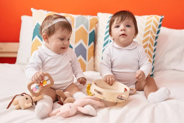 Two Adorable Babies Holding Tambourine Sitting Bed Bedroom — Stock Photo, Image