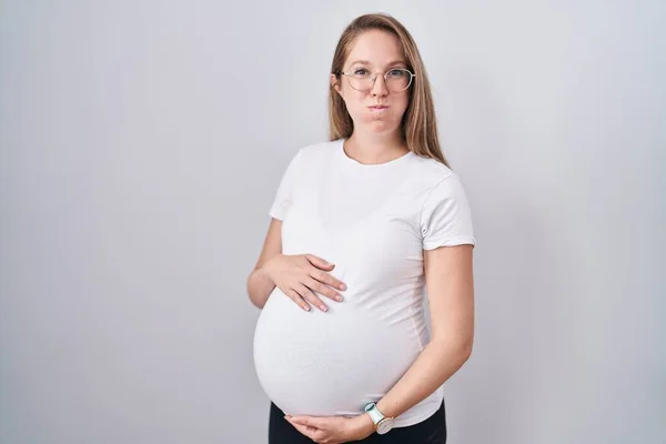 Young Pregnant Woman Expecting Baby Touching Pregnant Belly Puffing Cheeks — Stock Photo, Image