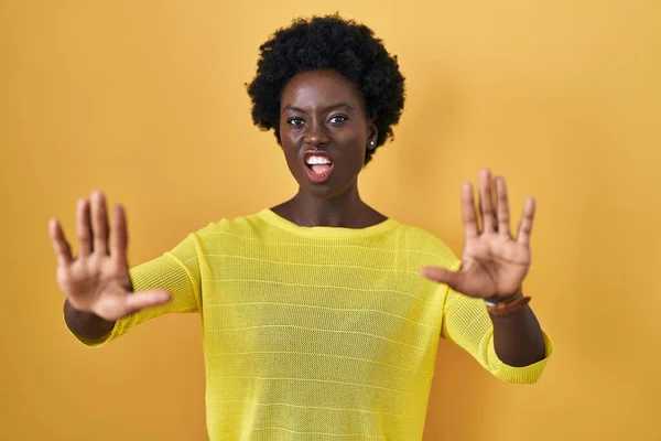 African Young Woman Standing Yellow Studio Doing Stop Gesture Hands — Photo