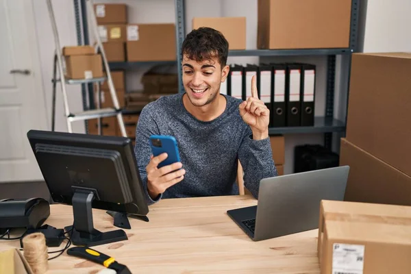 Young Hispanic Man Working Small Business Ecommerce Using Smartphone Serious — Fotografia de Stock