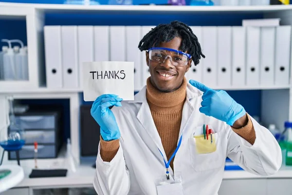 Young African Man Dreadlocks Working Scientist Laboratory Smiling Happy Pointing — Fotografia de Stock