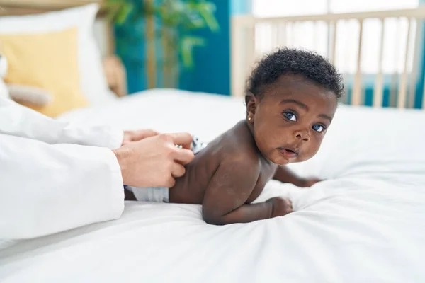 African American Baby Having Medical Examination Lying Bed Bedroom — Foto Stock