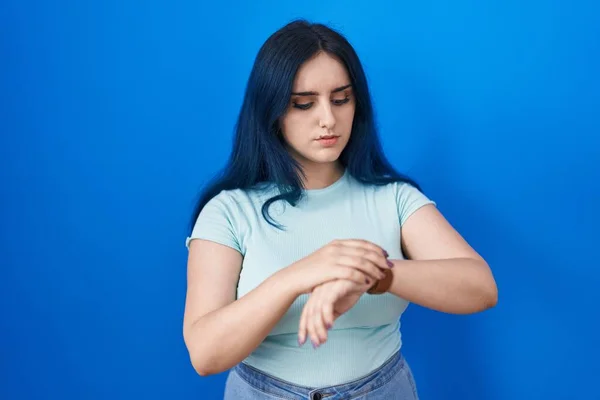 Young Modern Girl Blue Hair Standing Blue Background Checking Time — 스톡 사진