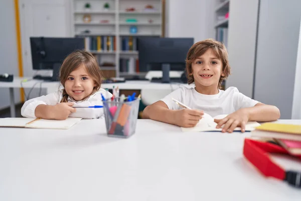Brother Sister Students Writing Notebook Studying Classroom — Stock Photo, Image