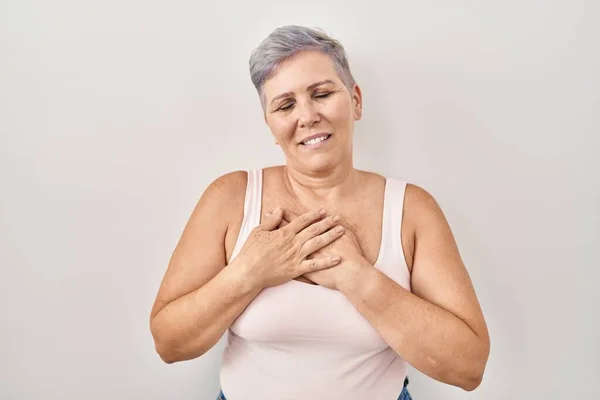 Middle Age Caucasian Woman Standing White Background Smiling Hands Chest — Stockfoto
