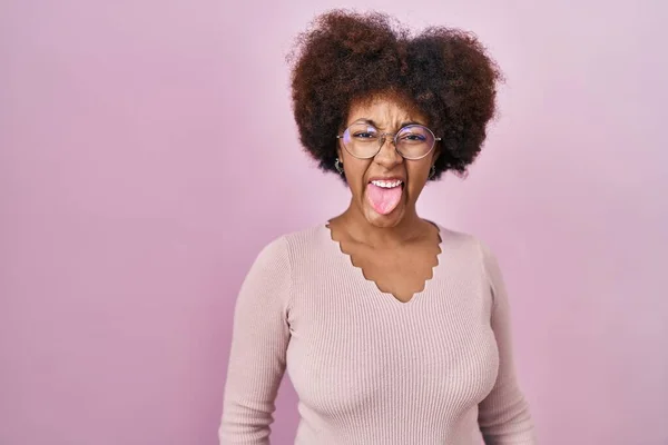 Young African American Woman Standing Pink Background Sticking Tongue Out — Fotografia de Stock