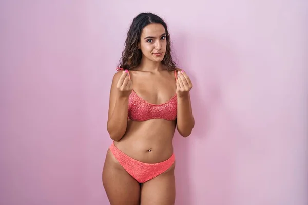 Young Hispanic Woman Wearing Lingerie Pink Background Doing Money Gesture — Foto de Stock