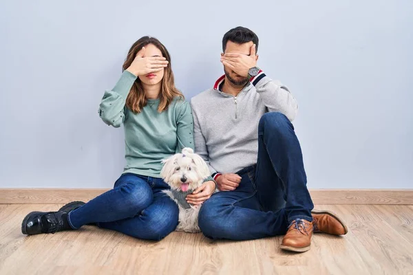 Young Hispanic Couple Sitting Floor Dog Covering Eyes Hand Looking — Stock Photo, Image