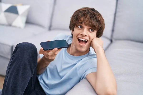 Young Blond Man Talking Smartphone Sitting Floor Home — Stock Photo, Image