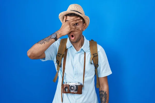 Brazilian Young Man Holding Vintage Camera Peeking Shock Covering Face — Foto Stock