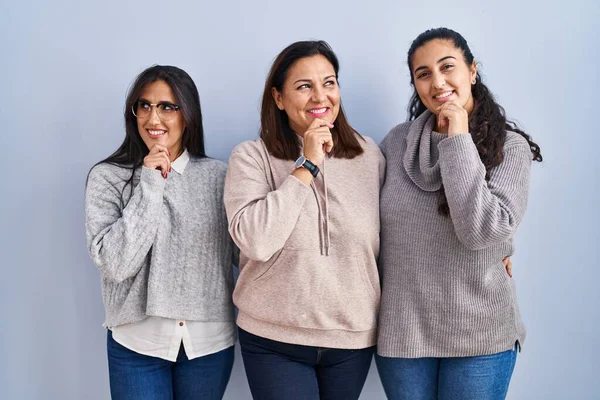 Mother Two Daughters Standing Blue Background Hand Chin Thinking Question — Stockfoto