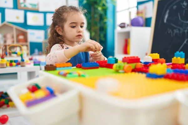 Adorable Blonde Girl Playing Construction Blocks Sitting Table Kindergarten — Stockfoto