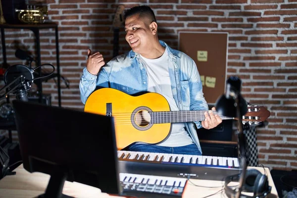 Hispanic Young Man Playing Classic Guitar Music Studio Smiling Happy — Fotografia de Stock