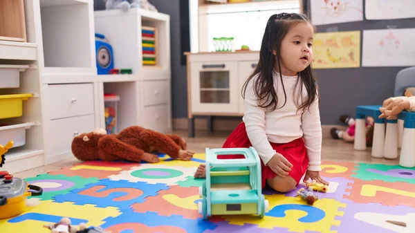 Adorable Hispanic Toddler Sitting Floor Playing Kindergarten — 스톡 사진