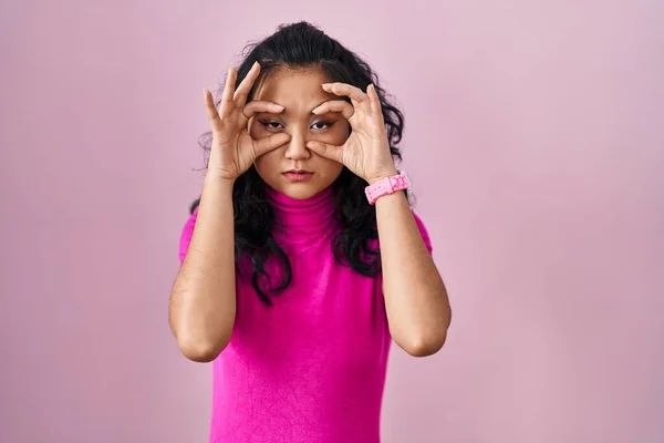 Young Asian Woman Standing Pink Background Trying Open Eyes Fingers —  Fotos de Stock