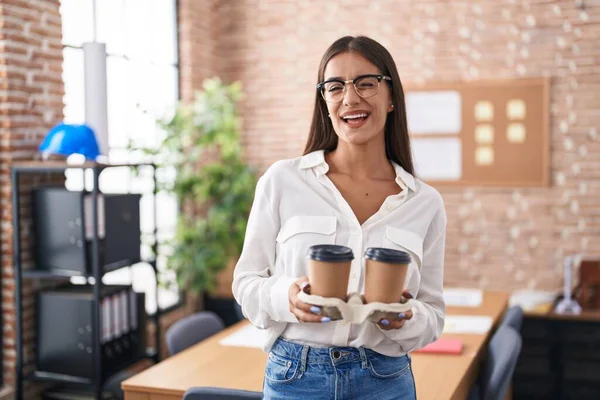 Young Brunette Woman Working Office Holding Take Away Coffee Winking — Stock Photo, Image