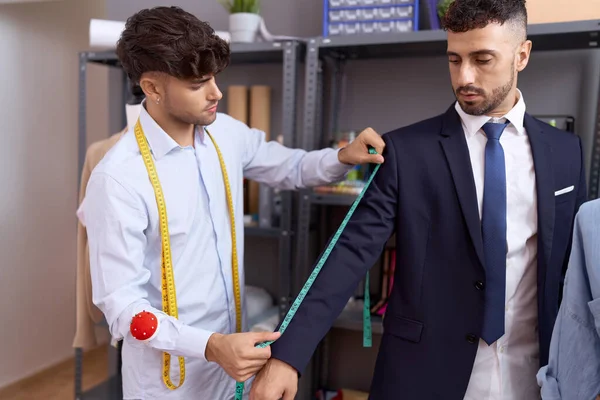 Two Hispanic Men Tailor Measuring Sleeve Jacket Client Atelier — Stockfoto