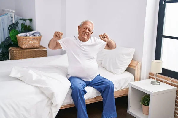 Senior Grey Haired Man Waking Stretching Arms Bedroom — Fotografia de Stock