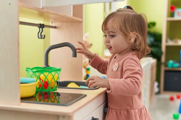 Adorable Blonde Girl Playing Play Kitchen Standing Kindergarten — Stock Photo, Image