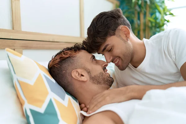 Two Hispanic Men Couple Hugging Each Other Lying Bed Bedroom —  Fotos de Stock