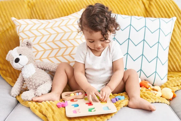 Adorable Hispanic Toddler Playing Maths Game Sitting Sofa Home — Stock Photo, Image