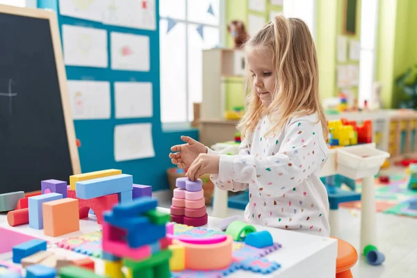 Adorable Blonde Girl Playing Construction Blocks Standing Kindergarten — 스톡 사진