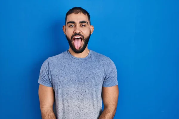 Middle East Man Beard Standing Blue Background Sticking Tongue Out — Fotografia de Stock