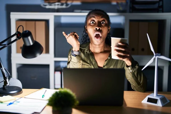 African Woman Working Using Computer Laptop Night Surprised Pointing Finger — Stok fotoğraf