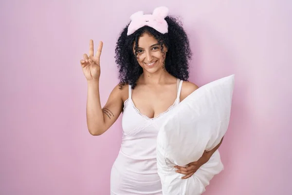 Hispanic Woman Curly Hair Wearing Sleep Mask Pajama Holding Pillow — Stockfoto