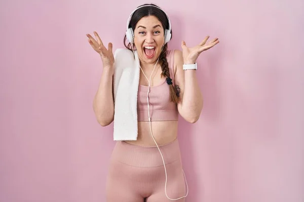 Young Brunette Woman Wearing Sportswear Headphones Celebrating Crazy Amazed Success — Photo