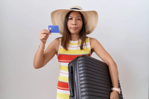 Middle Age Chinese Woman Holding Suitcase Credit Card Skeptic Nervous — Photo