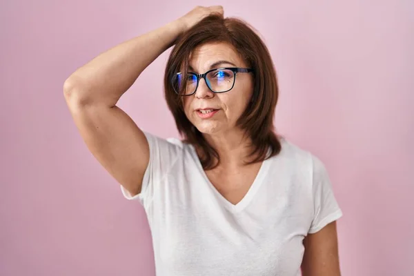 Middle Age Hispanic Woman Standing Pink Background Confuse Wondering Question — Stock Photo, Image
