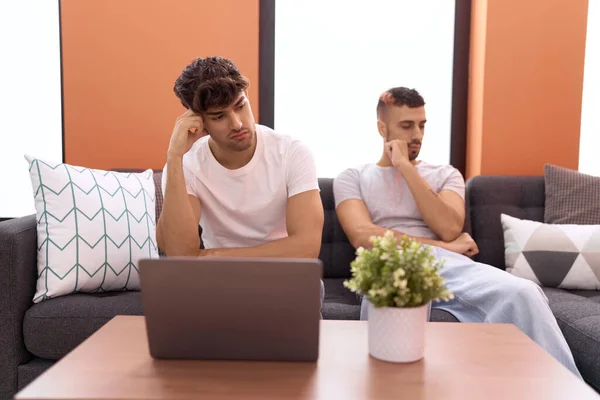 Two Hispanic Men Couple Sitting Sofa Sad Expression Home — Stock Photo, Image