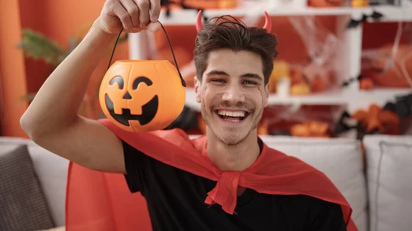 Young Hispanic Man Wearing Devil Costume Holding Halloween Pumpkin Basket — Foto Stock